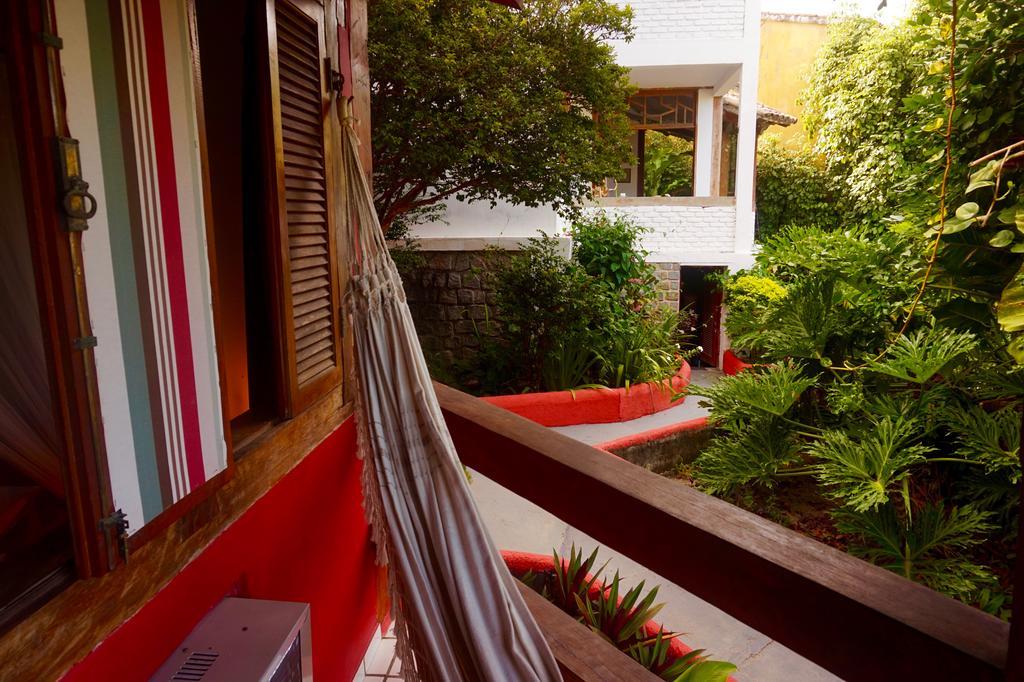 Novos Baianos Hostel E Pousada Porto Seguro Exteriör bild A hammock in a hotel in Tulum, Mexico