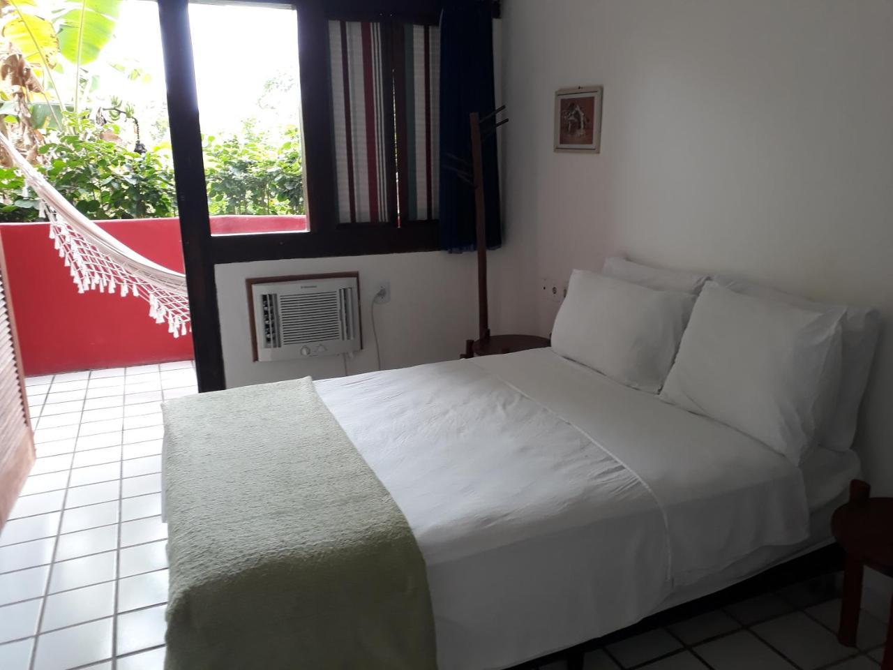Novos Baianos Hostel E Pousada Porto Seguro Exteriör bild A room at the hotel